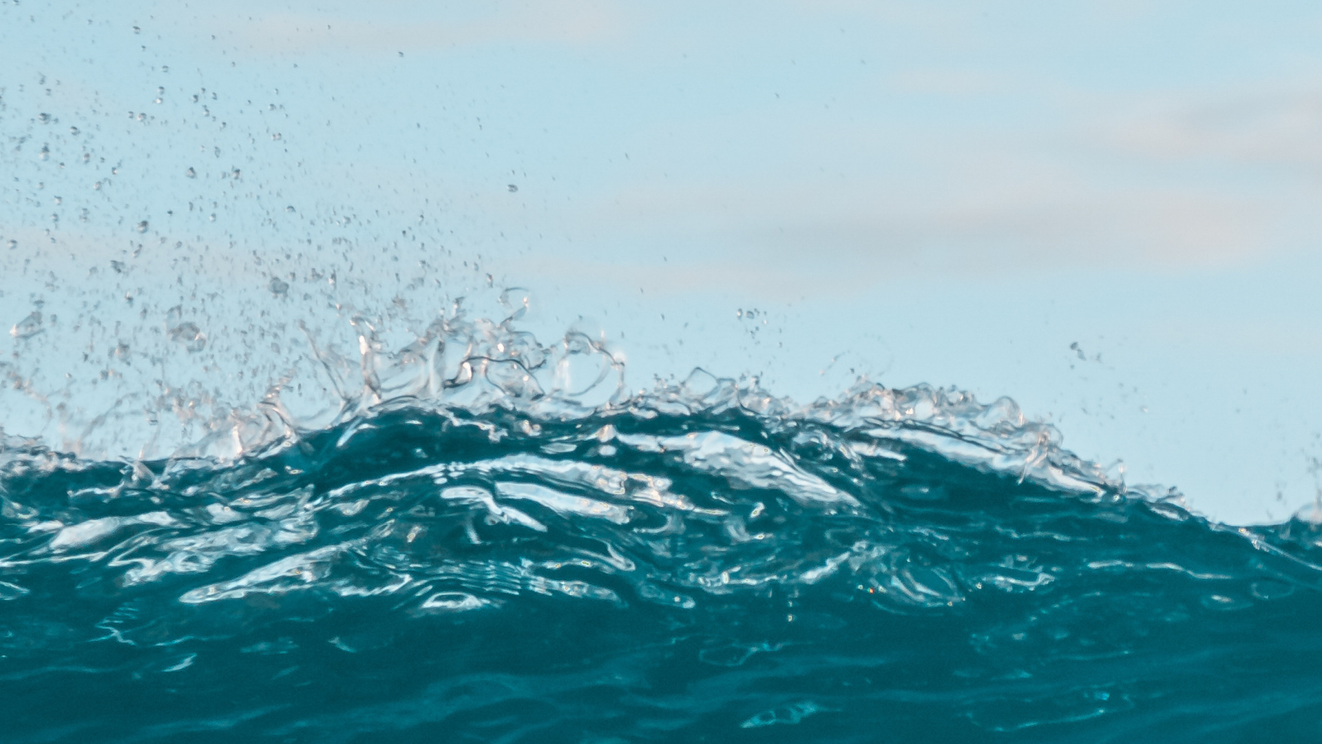 Waves splashing against the camera